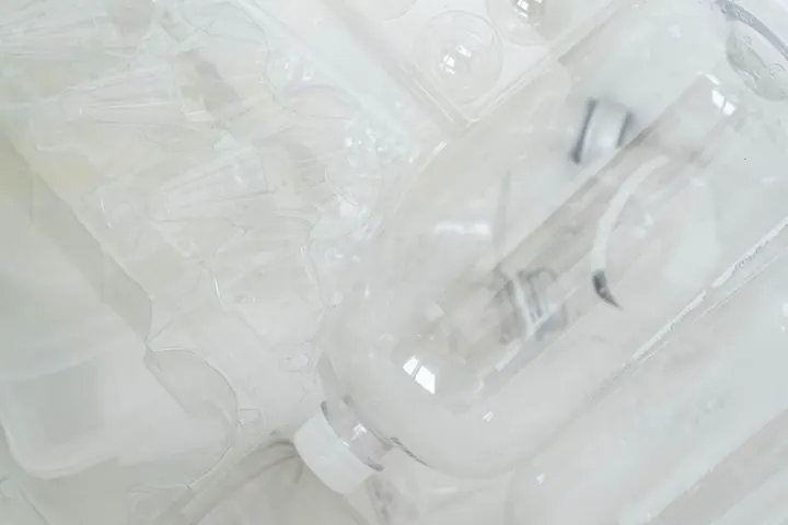 Clear plastic packaging and bottles grouped together