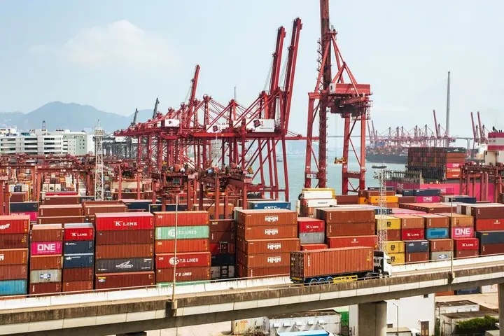 Shipping containers and cranes at an industrial port